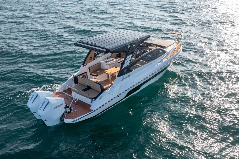  Yacht Photos Pics Aerial view of 2026 Hanover 305 boat cruising on open water.