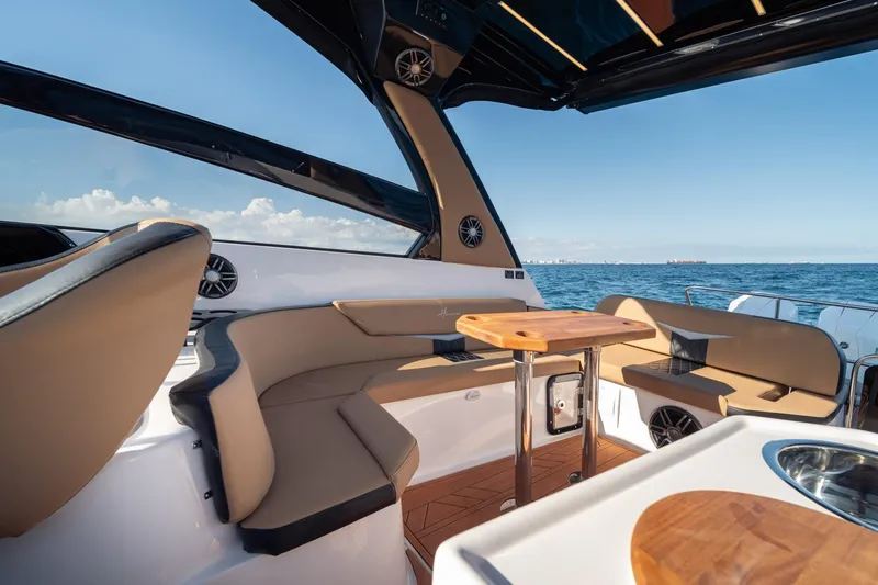 Yacht Photos Pics Luxurious Hanover 305 yacht interior, featuring elegant seating and ocean view, 2026 model.