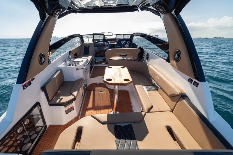  Yacht Photos Pics Luxurious 2026 Hanover 305 boat interior with elegant seating and ocean view.