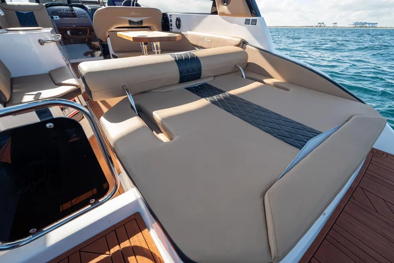  Yacht Photos Pics Luxurious 2026 Hanover 305 boat interior with elegant seating and ocean view.