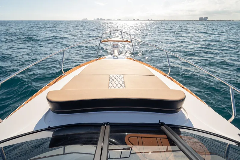  Yacht Photos Pics Front view of 2026 Hanover 305 boat cruising on open sea.