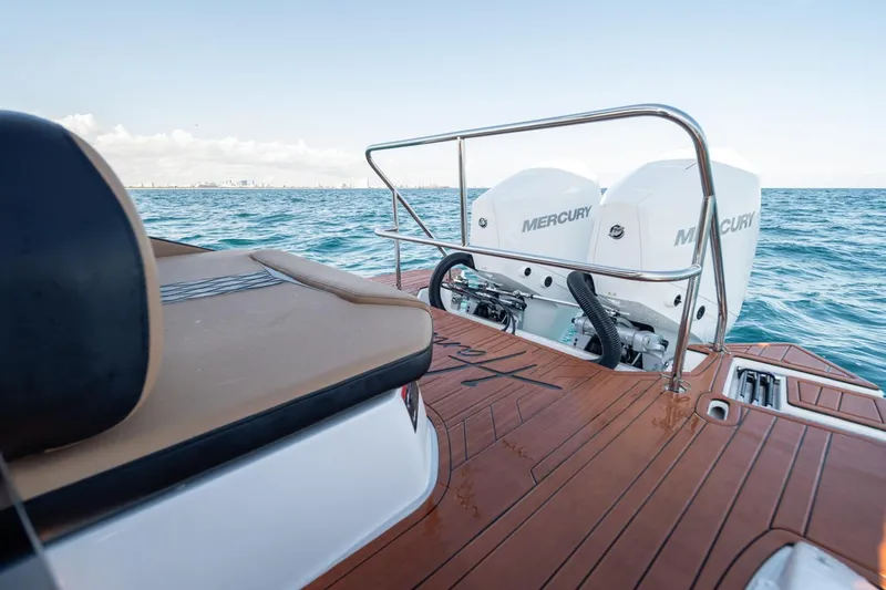  Yacht Photos Pics Luxury Hanover 305 boat with dual Mercury engines on open water, 2026 model.