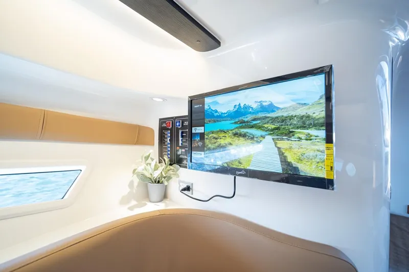  Yacht Photos Pics Luxurious interior of 2026 Hanover 305 yacht with TV and scenic view.