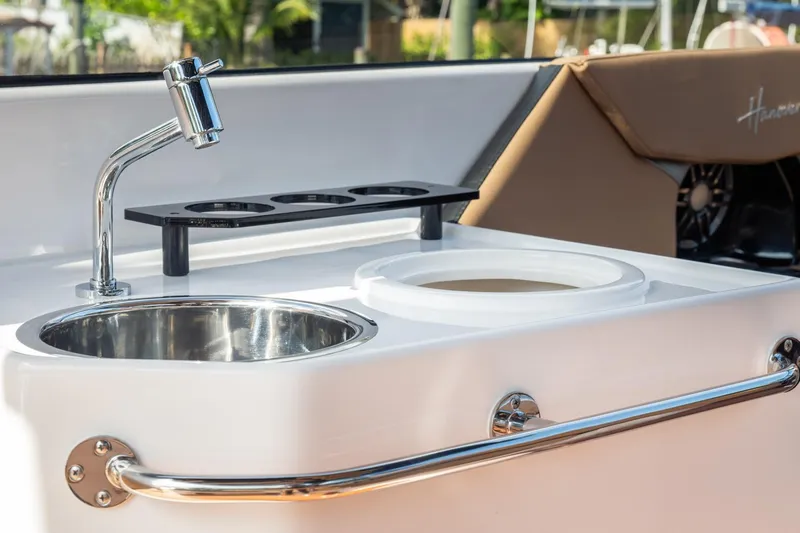  Yacht Photos Pics Luxury boat sink and faucet on Hanover 305, 2026 model, with cup holders.