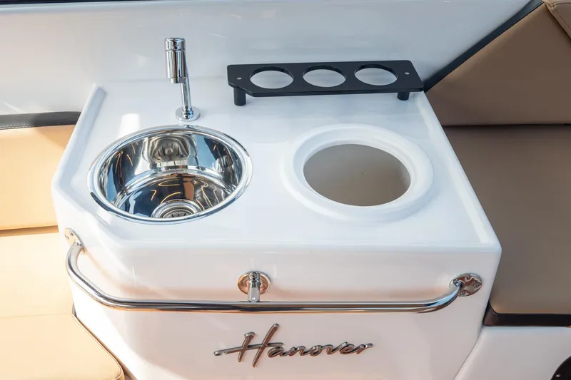  Yacht Photos Pics 2026 Hanover 305 boat sink and cup holder setup, featuring sleek design and functionality.