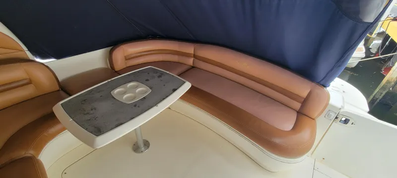  Yacht Photos Pics 2004 Sea Ray 455 Sundancer interior seating area with table.