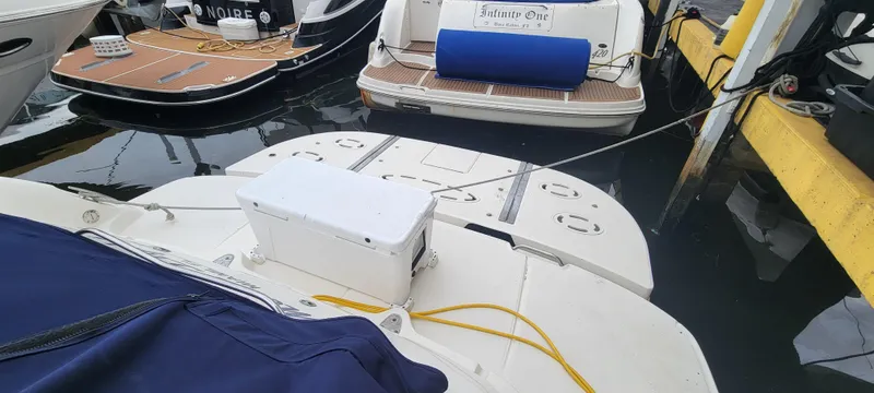  Yacht Photos Pics 2004 Sea Ray 455 Sundancer docked at marina with other boats.