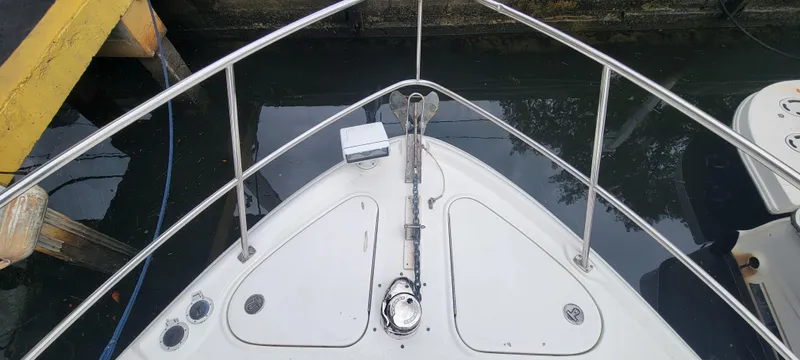  Yacht Photos Pics Bow of 2004 Sea Ray 455 Sundancer yacht docked at marina.