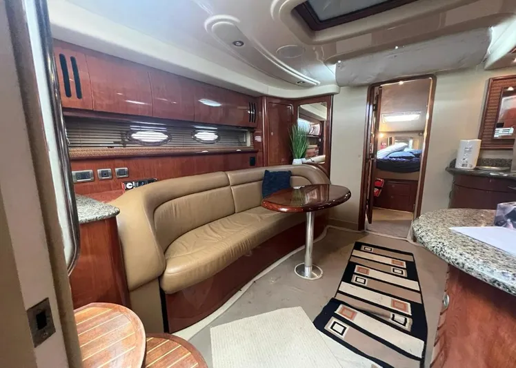  Yacht Photos Pics Luxurious interior of a 2004 Sea Ray 455 Sundancer yacht with leather seating and modern amenities.