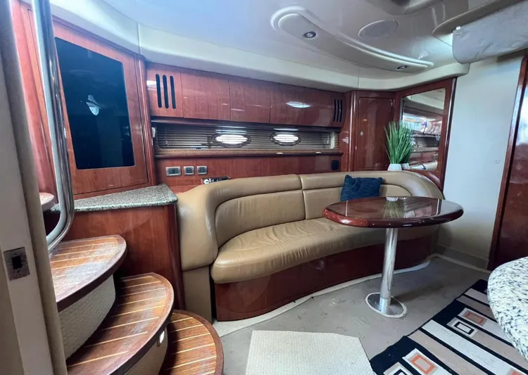  Yacht Photos Pics Luxurious interior of a 2004 Sea Ray 455 Sundancer yacht with leather seating and wooden finishes.