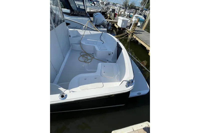 Old Fashioned (reserved) Yacht Photos Pics 2011 Back Cove 29 boat docked, featuring spacious deck and clean design.