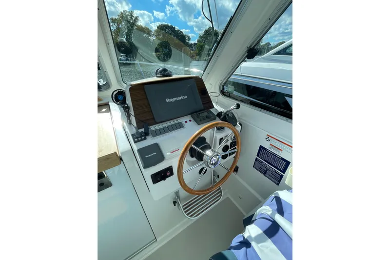 Old Fashioned (reserved) Yacht Photos Pics Helm of 2011 Back Cove 29 boat with Raymarine navigation system.