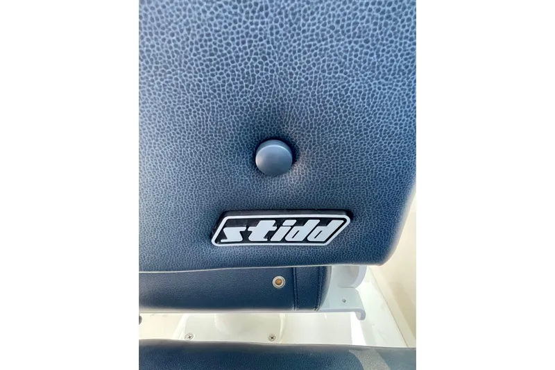 Old Fashioned (reserved) Yacht Photos Pics Stidd seat detail on 2011 Back Cove 29 boat, featuring textured upholstery.
