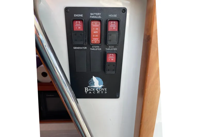 Old Fashioned (reserved) Yacht Photos Pics Control panel of a 2011 Back Cove 29 yacht with labeled switches.