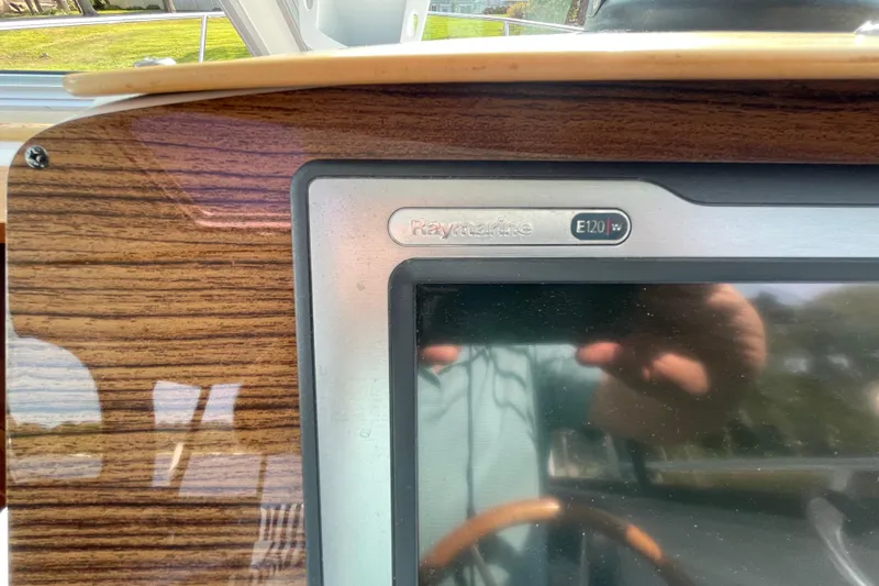 Old Fashioned (reserved) Yacht Photos Pics Raymarine E120 display on 2011 Back Cove 29 boat dashboard with wood finish.