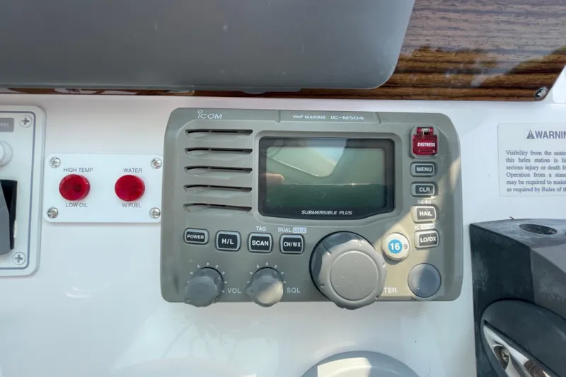 Old Fashioned (reserved) Yacht Photos Pics VHF marine radio on 2011 Back Cove 29 boat dashboard with warning indicators.