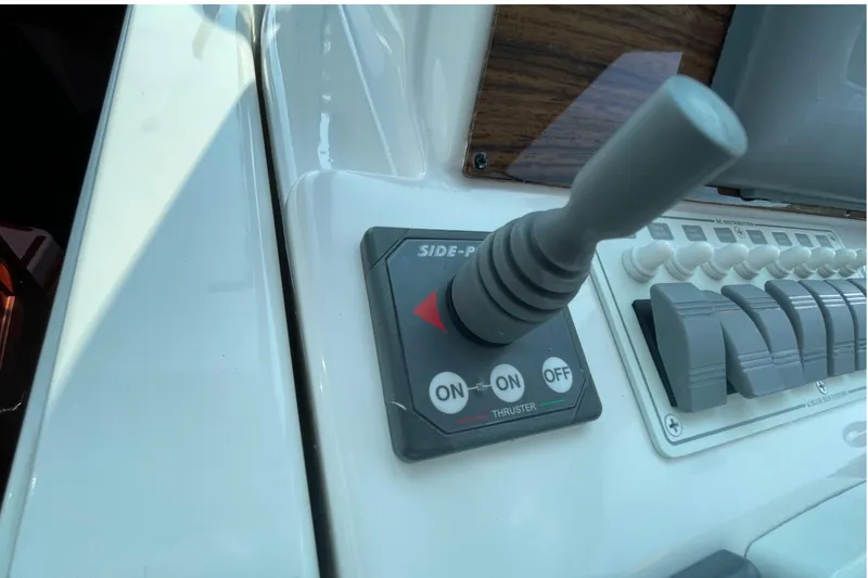 Old Fashioned (reserved) Yacht Photos Pics Control panel of a 2011 Back Cove 29 boat featuring a joystick and switches.