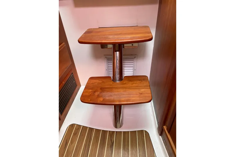 Old Fashioned (reserved) Yacht Photos Pics Wooden steps inside a 2011 Back Cove 29 boat, featuring polished metal support.