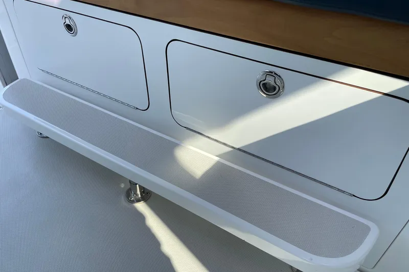 Old Fashioned (reserved) Yacht Photos Pics 2011 Back Cove 29 boat interior with storage compartments and seating area.