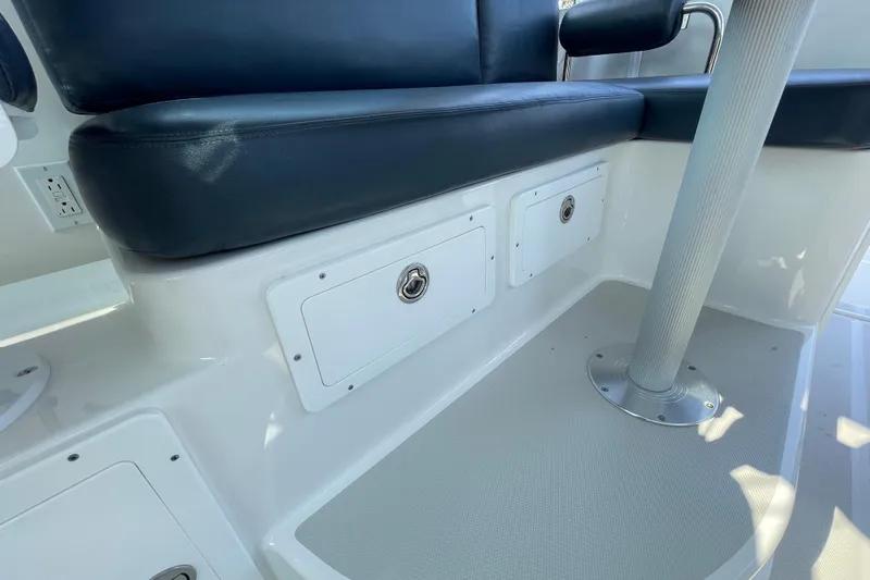 Old Fashioned (reserved) Yacht Photos Pics 2011 Back Cove 29 boat interior with cushioned seating and storage compartments.