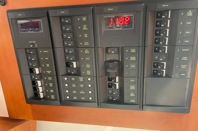 Old Fashioned (reserved) Yacht Photos Pics Electrical control panel of a 2011 Back Cove 29 boat, featuring various switches and meters.