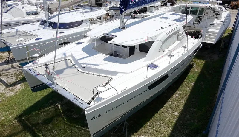 Diastema Yacht Photos Pics 2016 Leopard 44 catamaran docked, showcasing sleek design and spacious deck layout.