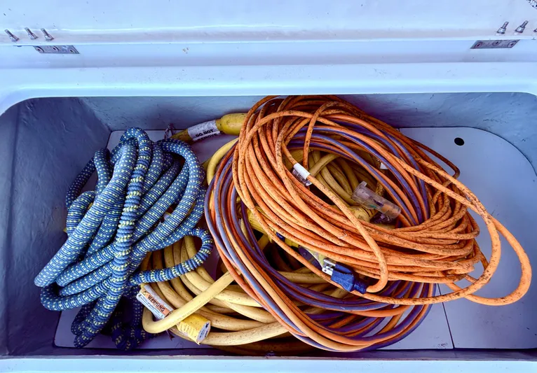 Diastema Yacht Photos Pics Coiled ropes and cables stored in a compartment of a 2016 Leopard 44 boat.