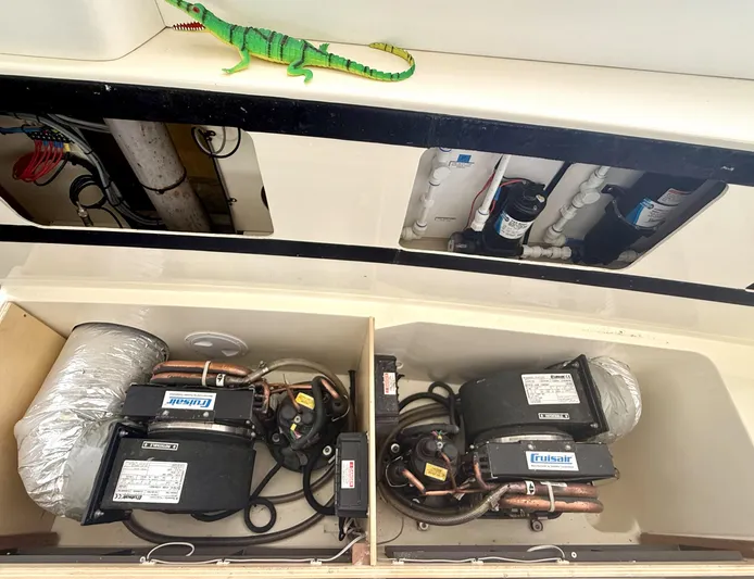 Diastema Yacht Photos Pics Air conditioning units in a 2016 Leopard 44 catamaran, with visible wiring and ductwork.