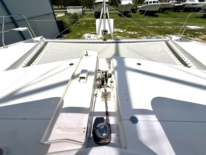 Diastema Yacht Photos Pics Deck view of 2016 Leopard 44 catamaran, showcasing anchor system and netting.