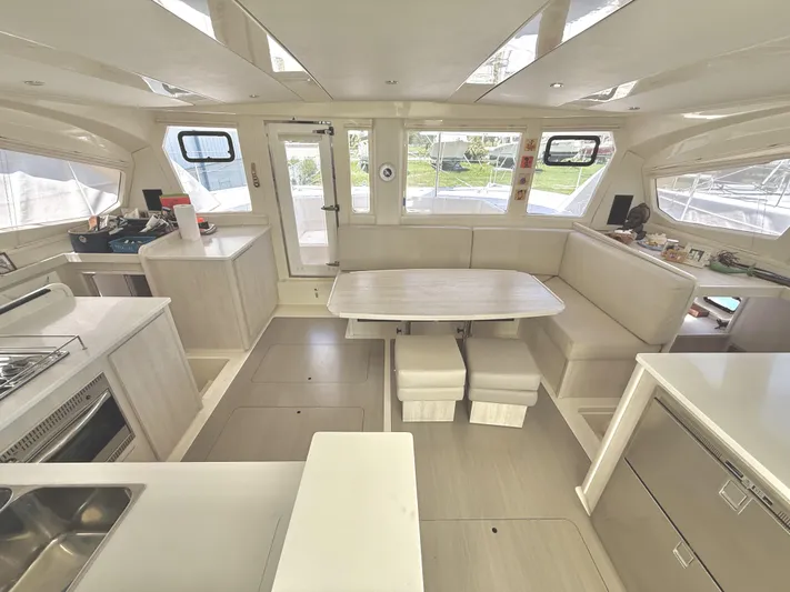 Diastema Yacht Photos Pics Spacious interior of 2016 Leopard 44 catamaran with modern kitchen and dining area.