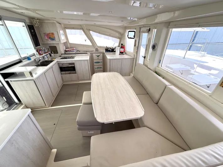 Diastema Yacht Photos Pics Spacious interior of 2016 Leopard 44 yacht with modern kitchen and dining area.