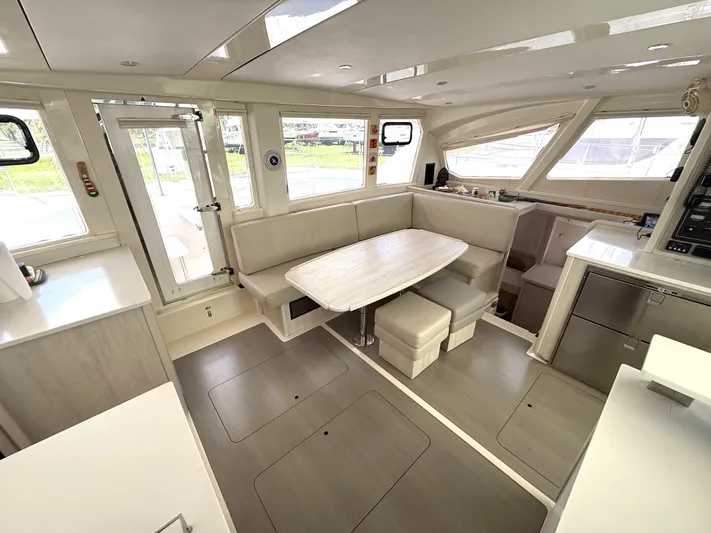 Diastema Yacht Photos Pics Spacious interior of 2016 Leopard 44 catamaran with modern dining area and ample seating.