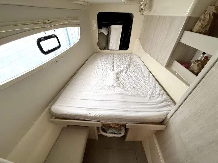 Diastema Yacht Photos Pics Compact cabin interior of a 2016 Leopard 44 yacht with a neatly made bed.
