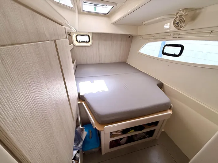 Diastema Yacht Photos Pics Compact cabin interior of 2016 Leopard 44 yacht with bed and storage.