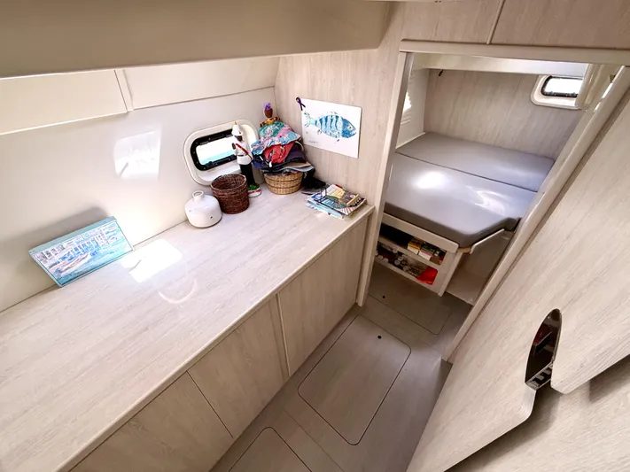 Diastema Yacht Photos Pics Modern interior of 2016 Leopard 44 yacht with cozy cabin and storage space.