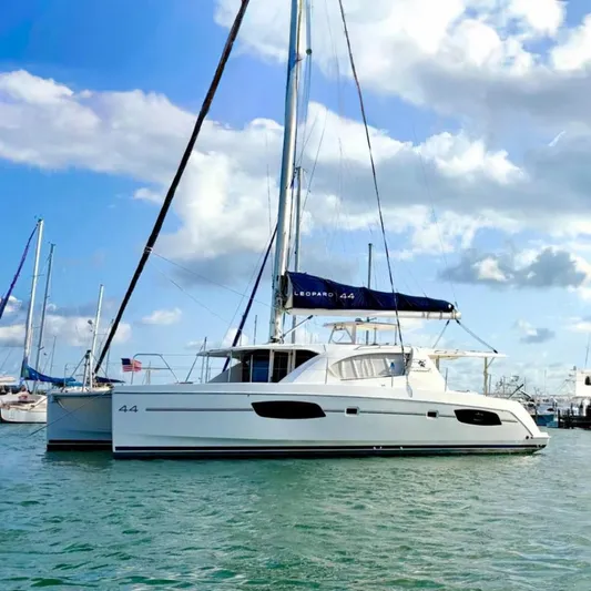 Diastema Yacht Photos Pics 2016 Leopard 44 catamaran sailing on calm waters under a blue sky.