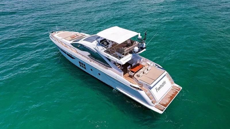 Fantastic Yacht Photos Pics Luxurious 2019 Azimut 77S yacht cruising on clear blue waters.