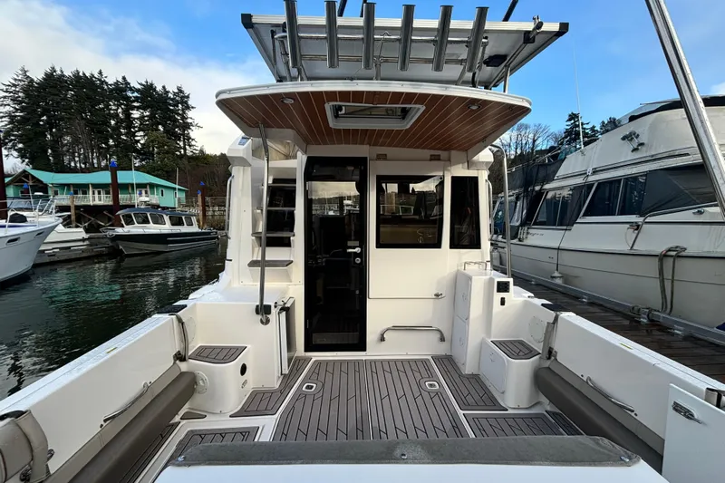  Yacht Photos Pics Rear view of 2021 Cutwater C-32 CB yacht docked in marina.
