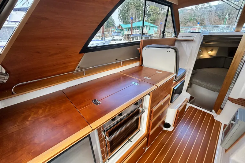  Yacht Photos Pics Interior of 2021 Cutwater C-32 CB yacht with wooden finish.