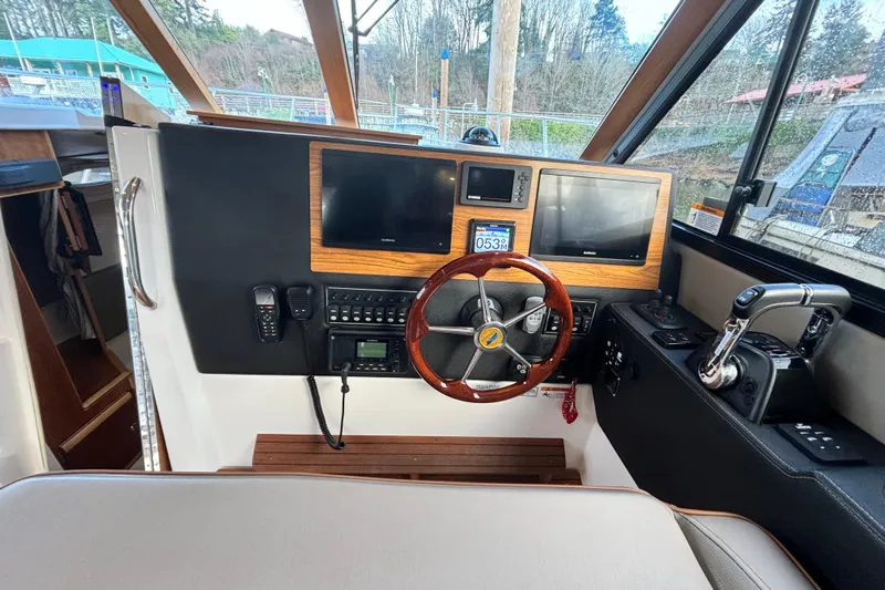  Yacht Photos Pics Interior view of a 2021 Cutwater C-32 CB boat helm.