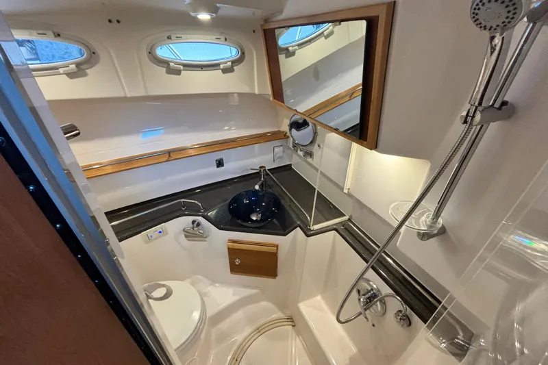  Yacht Photos Pics Interior view of bathroom on a 2021 Cutwater C-32 CB boat.