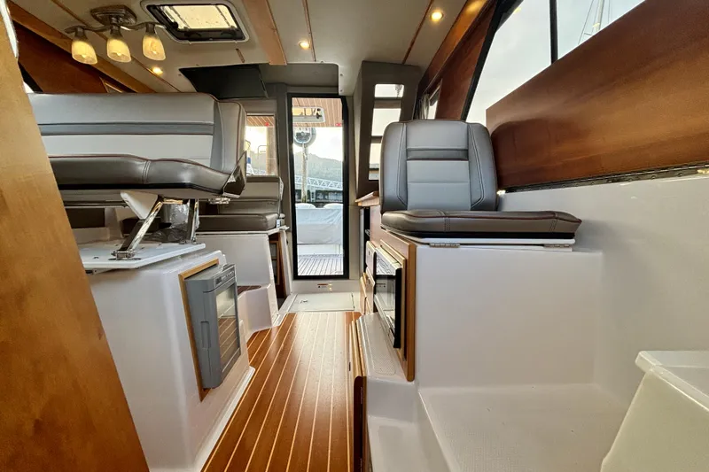  Yacht Photos Pics Interior of 2021 Cutwater C-32 CB boat with modern seating.
