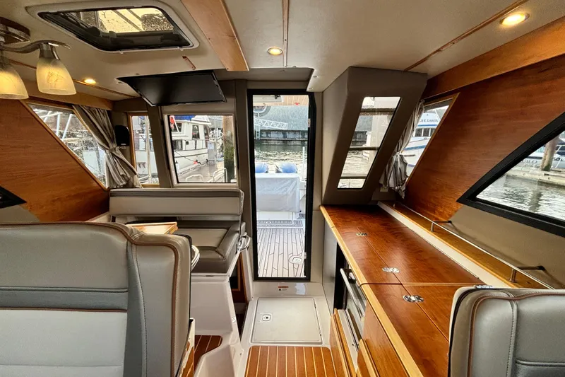  Yacht Photos Pics Interior of 2021 Cutwater C-32 CB boat with wood accents.