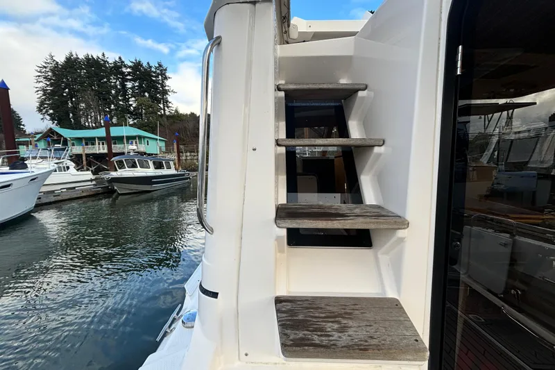  Yacht Photos Pics Staircase on a 2021 Cutwater C-32 CB boat in the marina.