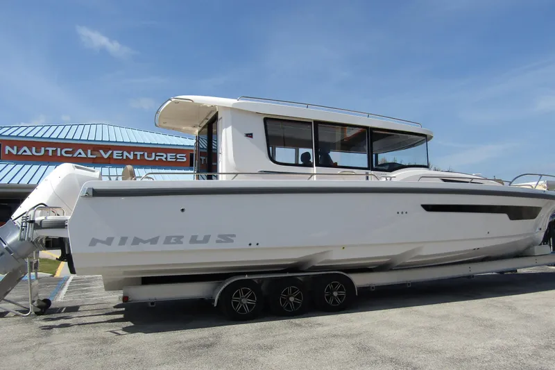  Yacht Photos Pics 2025 Nimbus Commuter 11 boat on trailer at Nautical Ventures dealership.