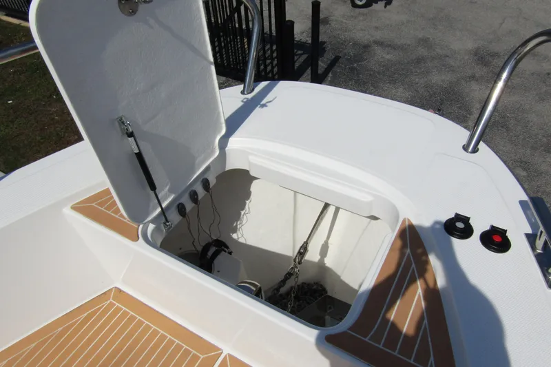  Yacht Photos Pics Open hatch on 2025 Nimbus Commuter 11 boat, revealing storage compartment.