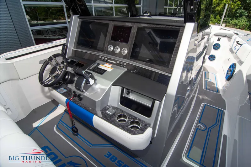  Yacht Photos Pics 2024 Fountain 38 SCX boat cockpit with advanced control panel and steering wheel.