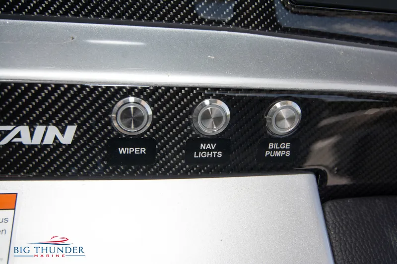  Yacht Photos Pics Control panel of 2024 Fountain 38 SCX boat with wiper, nav lights, and bilge pumps buttons.