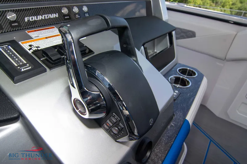  Yacht Photos Pics Control panel of a 2024 Fountain 38 SCX boat with throttle and cup holders.