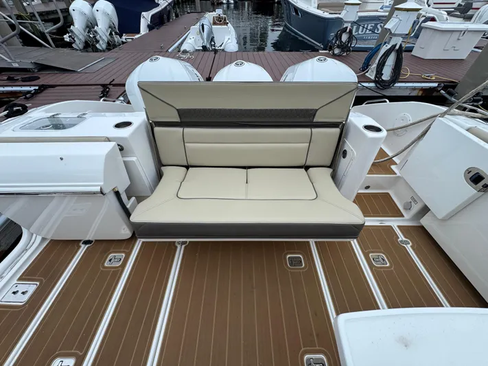  Yacht Photos Pics 2019 Pursuit DC 365 Dual Console boat with beige seating and teak-style flooring.